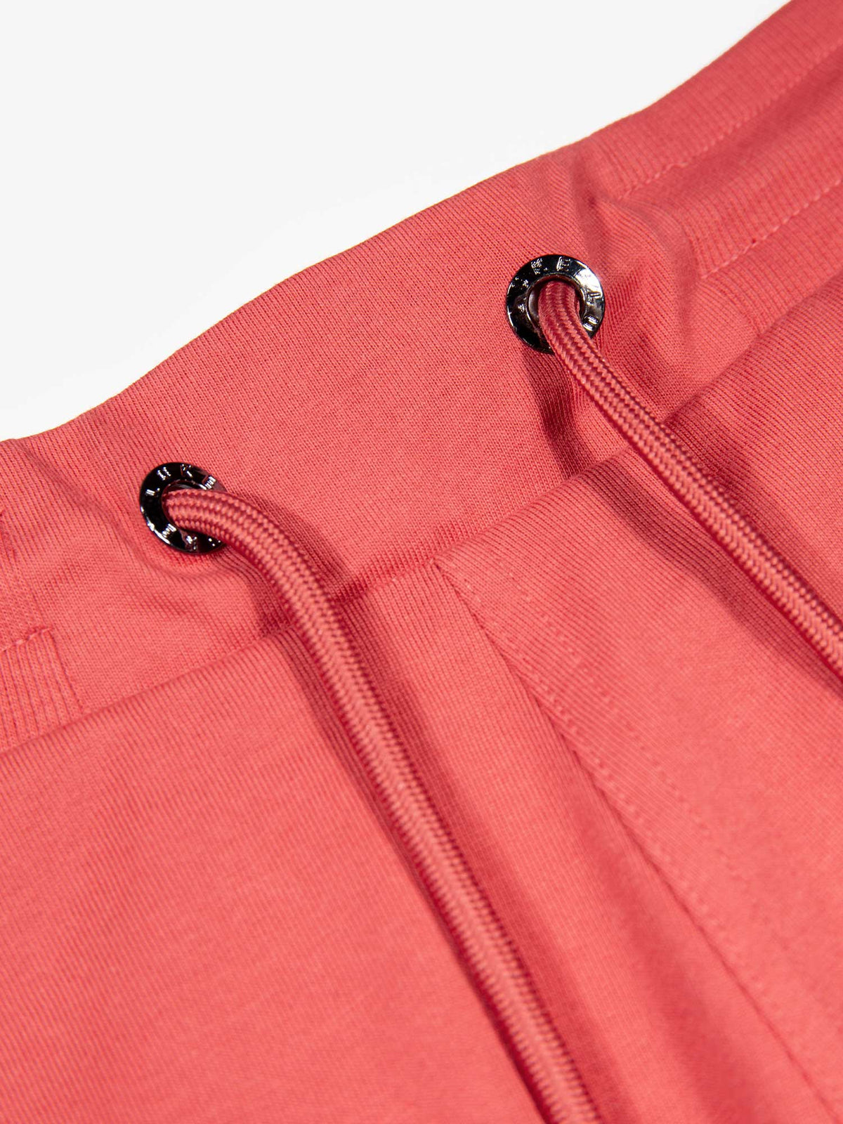 Men's red short set with short-sleeve shirt and drawstring shorts, detail view of the shorts.
