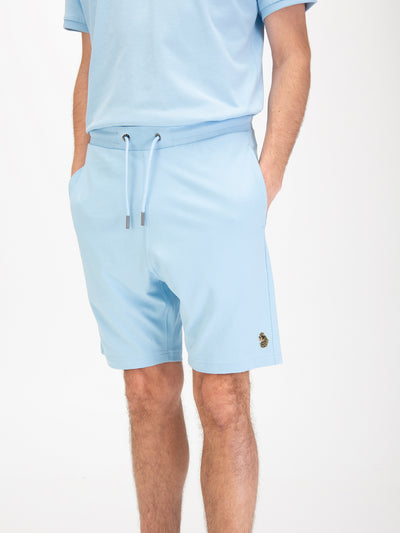 Men's blue-1 shorts with drawstring waistband, worn by a model, detail view