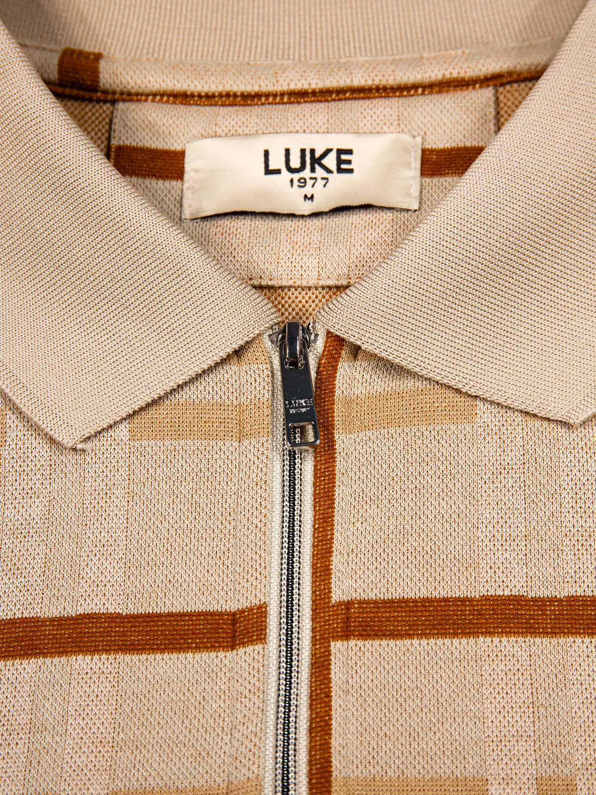 Men's beige polo shirt with polo collar.