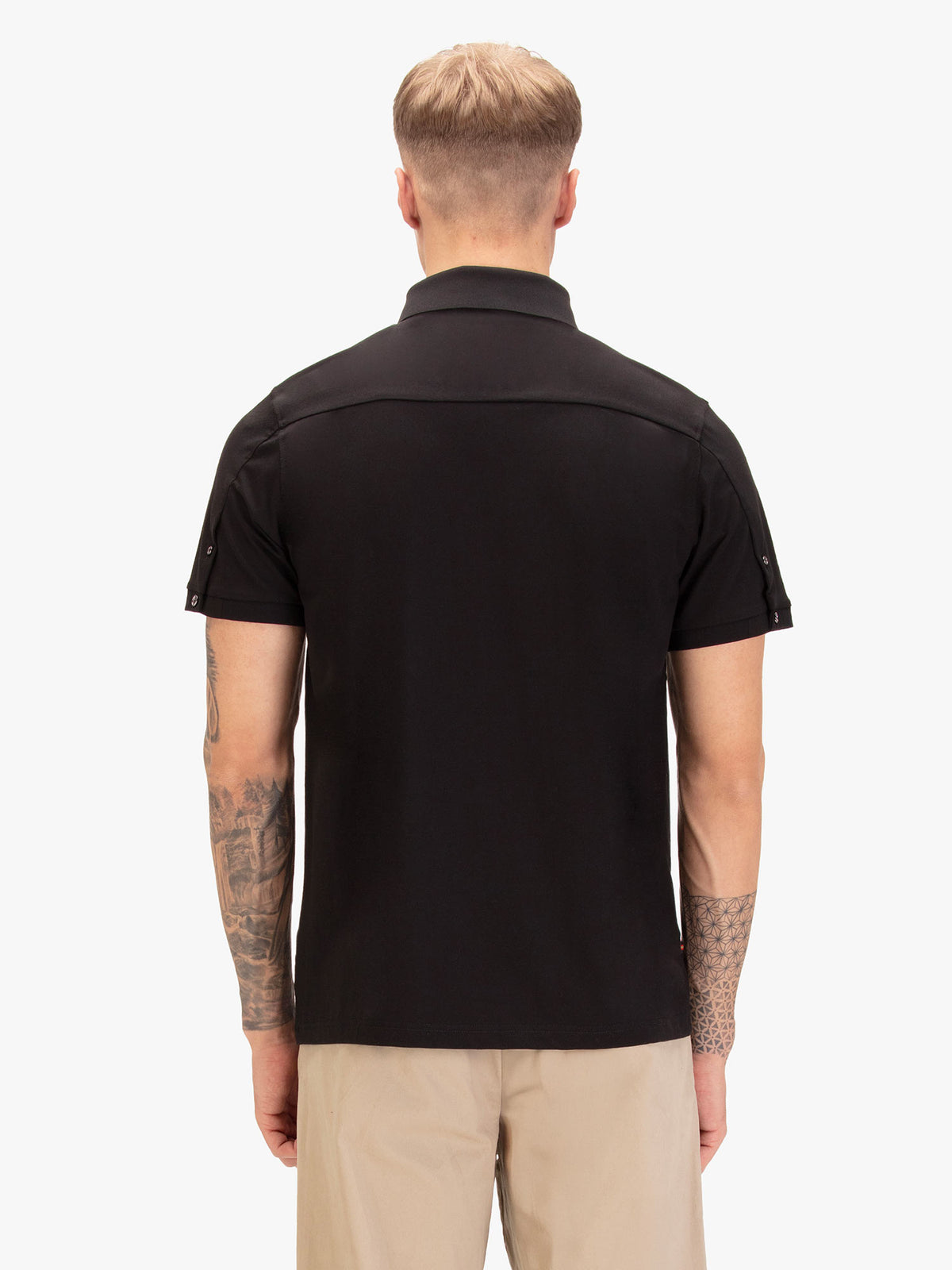 Back view of black LUKE 1977 Macau modal polo shirt worn by model