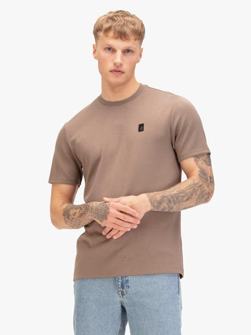 Men's brown t-shirt with crew neck and short sleeves, worn by a model, front view