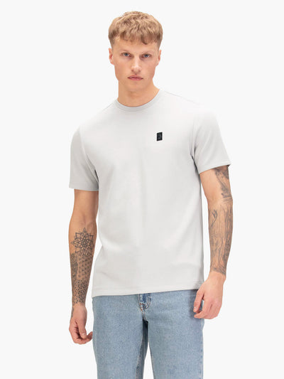 Men's grey t-shirt with crew neck and short sleeves, worn by a model, front view