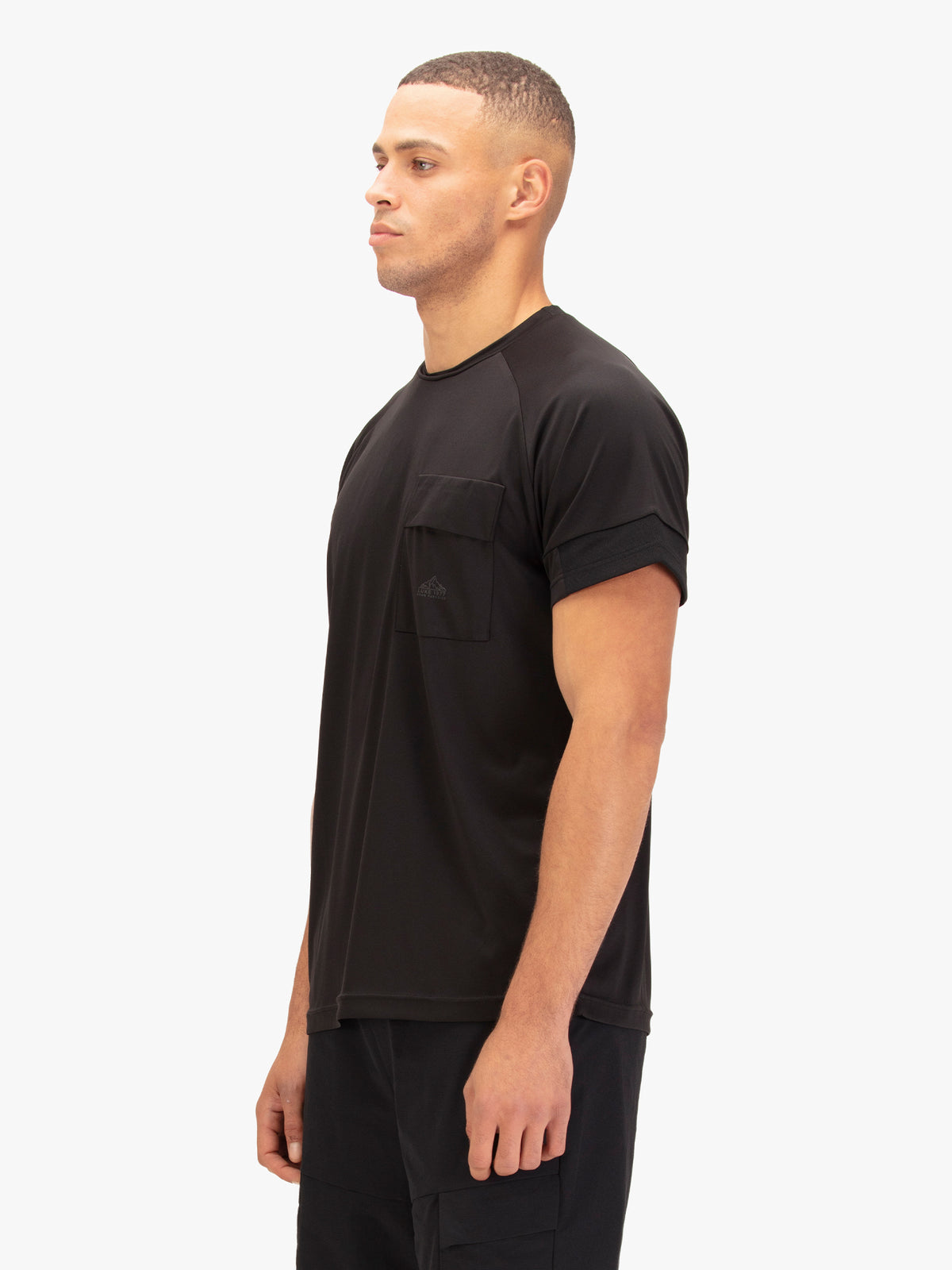Men's black t-shirt with crew neck and short sleeves worn by a model - back view.