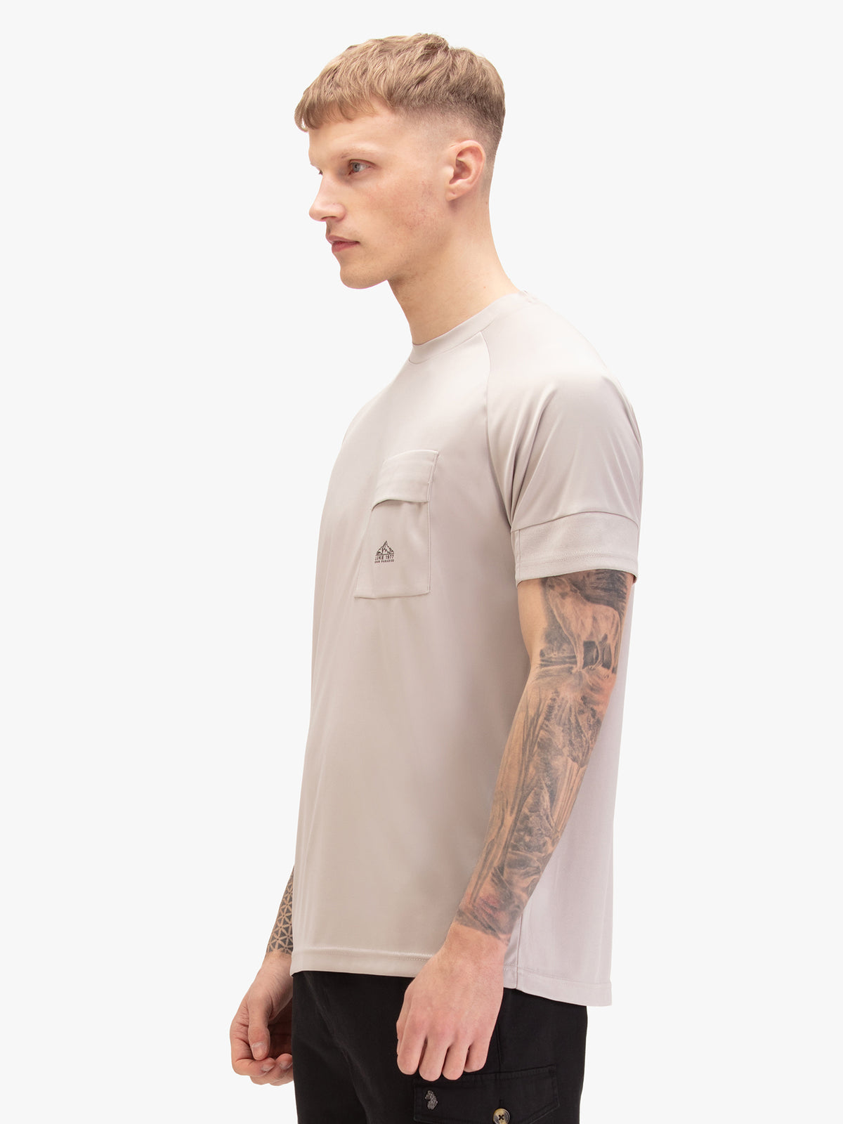Men's grey t-shirt with crew neck and short sleeves, worn by a model, side view