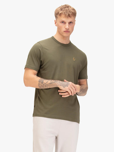 Men's green t-shirt with crew neck and short sleeves, worn by a model, front view