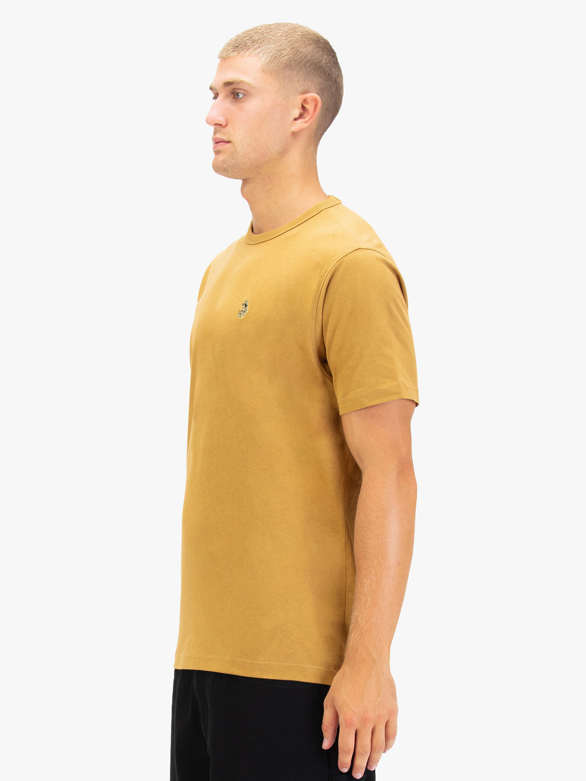 Men's yellow t-shirt with crew neck and short sleeves worn by a model - side view.