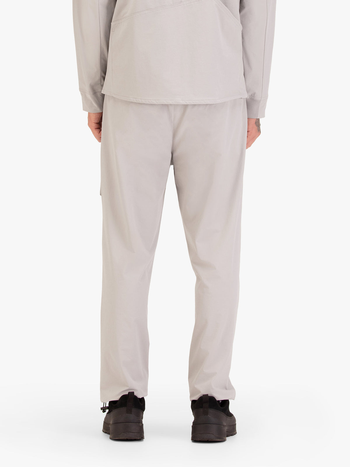 Men's grey joggers with elasticated waistband and cargo pockets.