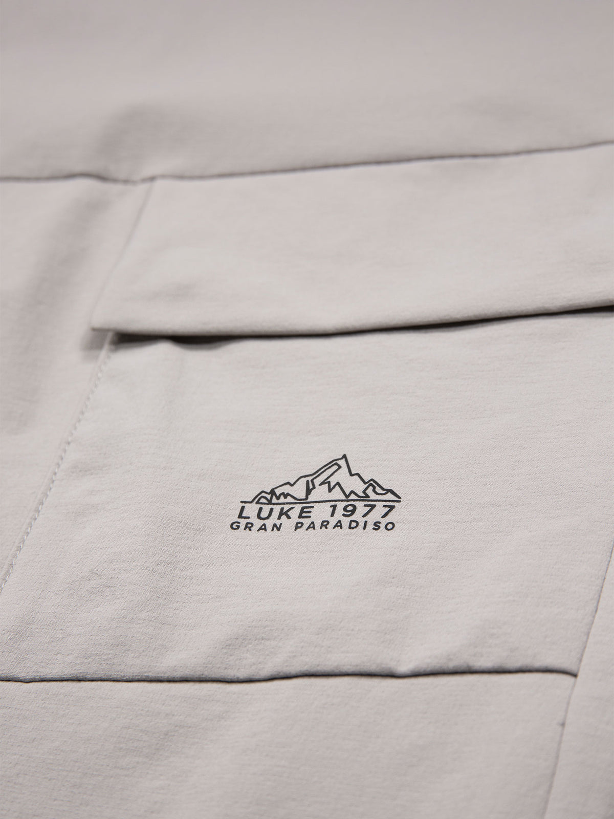 Men's grey joggers with elasticated waistband and cargo pockets.