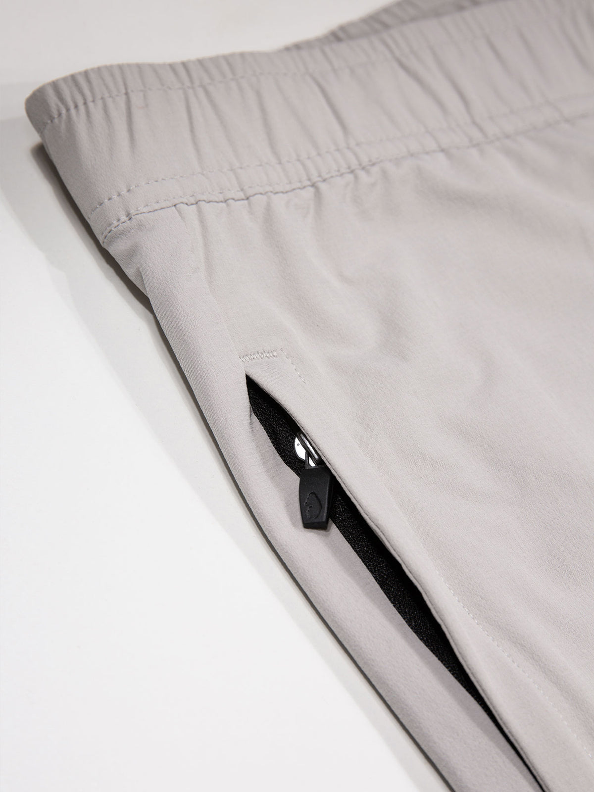 Men's grey joggers with elasticated waistband and cargo pockets.