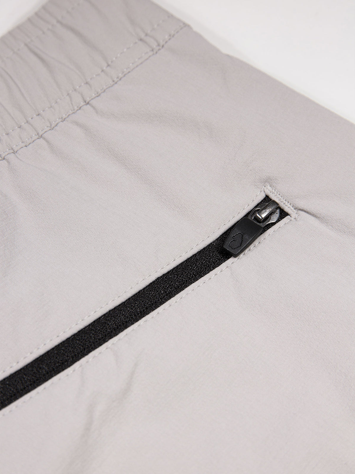 Men's grey joggers with elasticated waistband and cargo pockets.