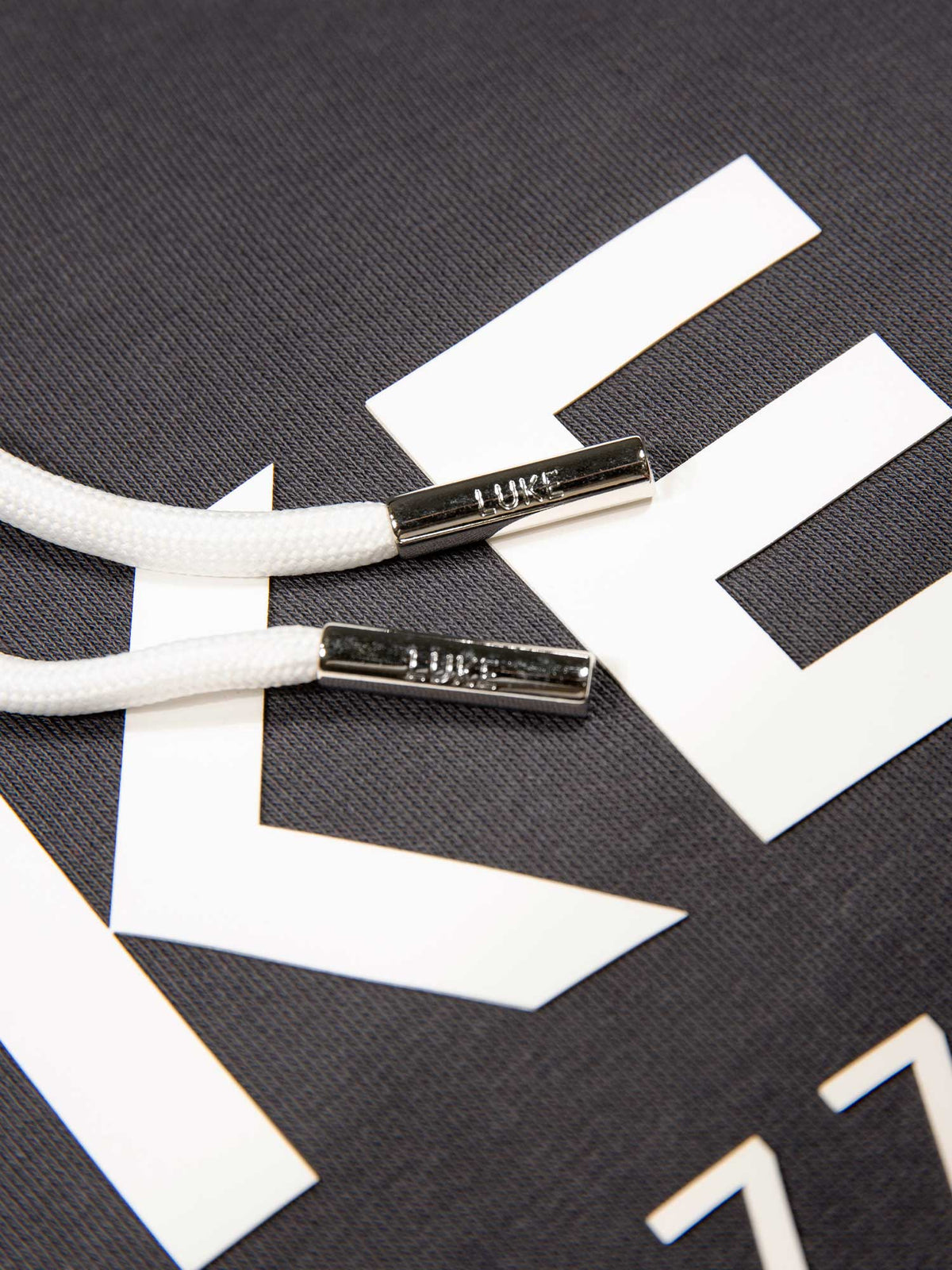 Men's relaxed-fit grey hoodie with front pocket and drawstring hood, detail view 3