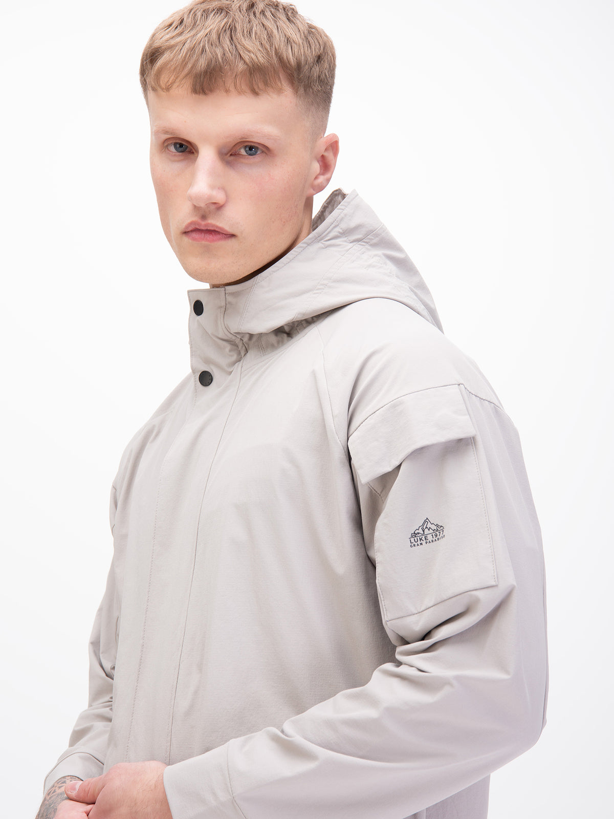 Men's grey jacket with zip-up front, worn by a model