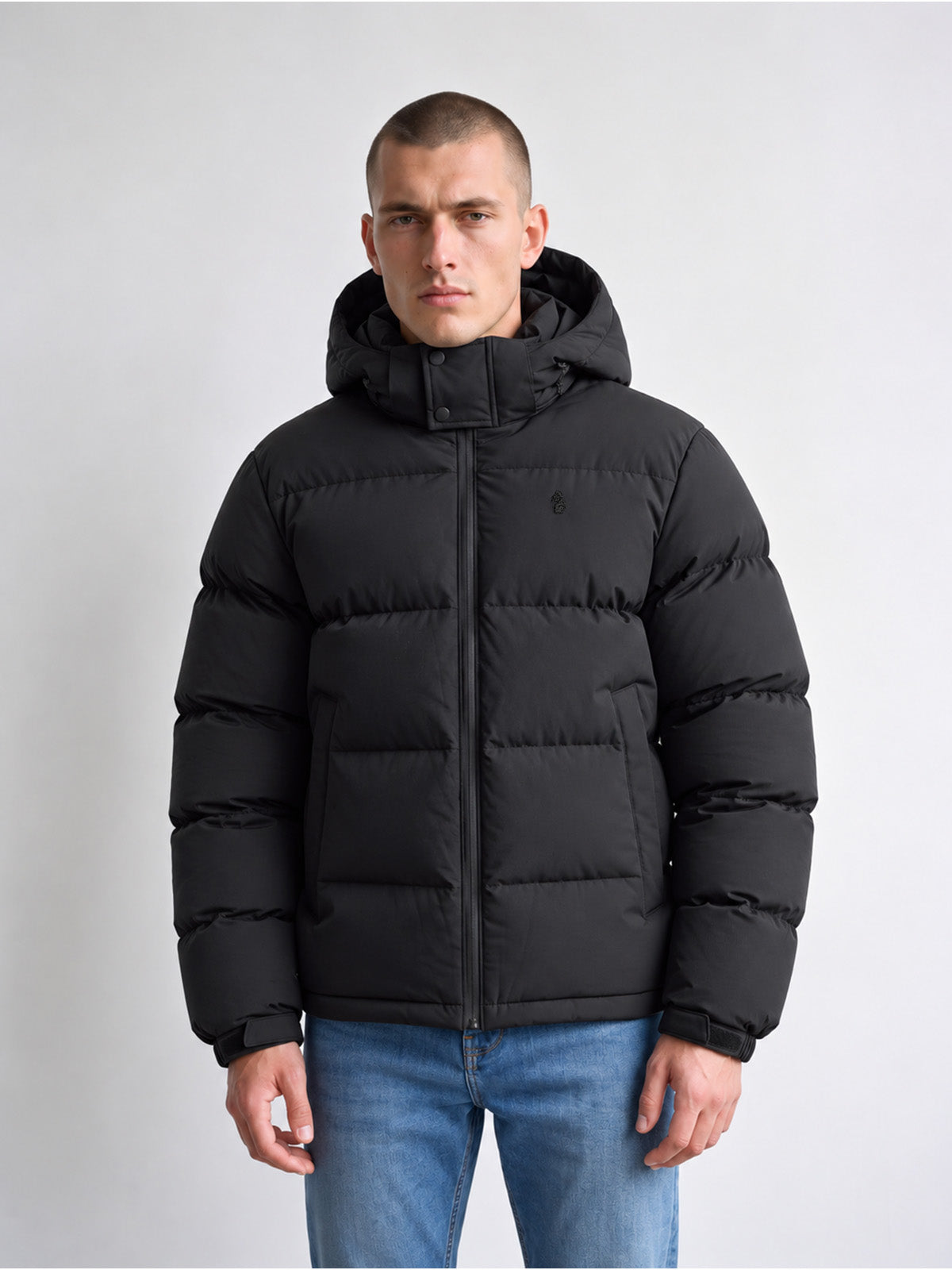 Man wearing black LUKE 1977 Auckland padded jacket with jeans, front view