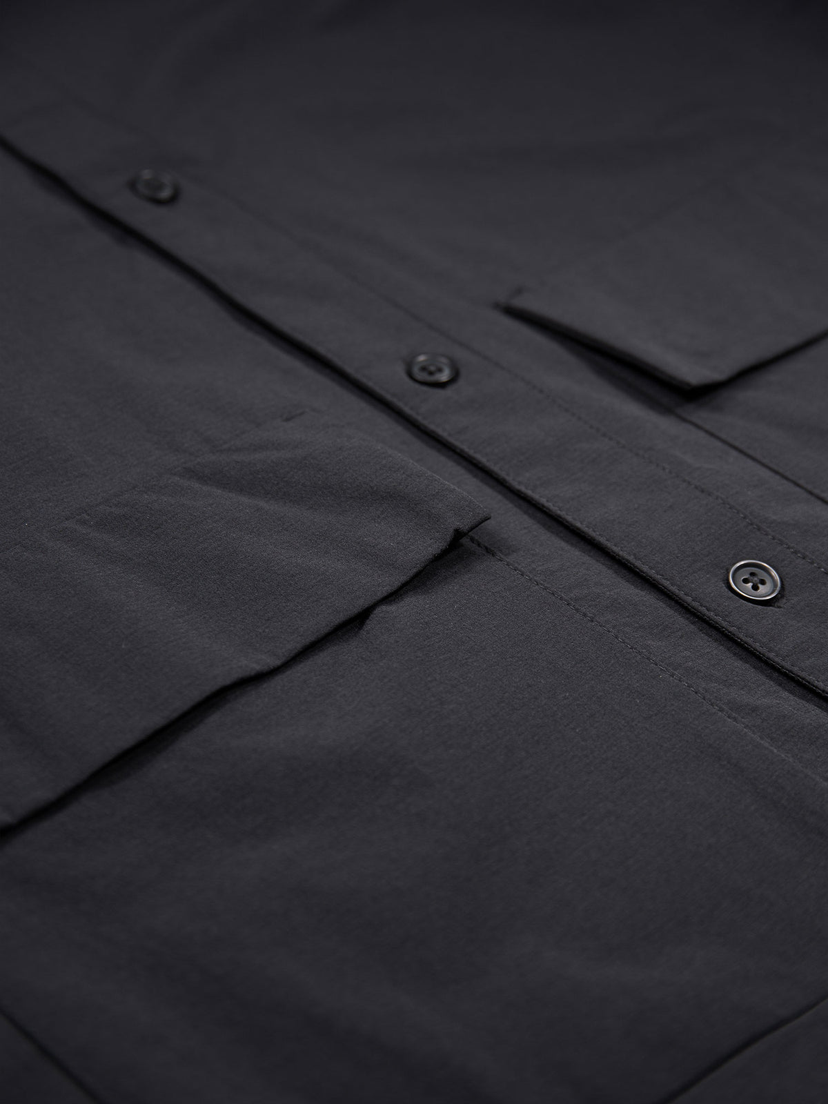 Men's black shirt with button-up front.