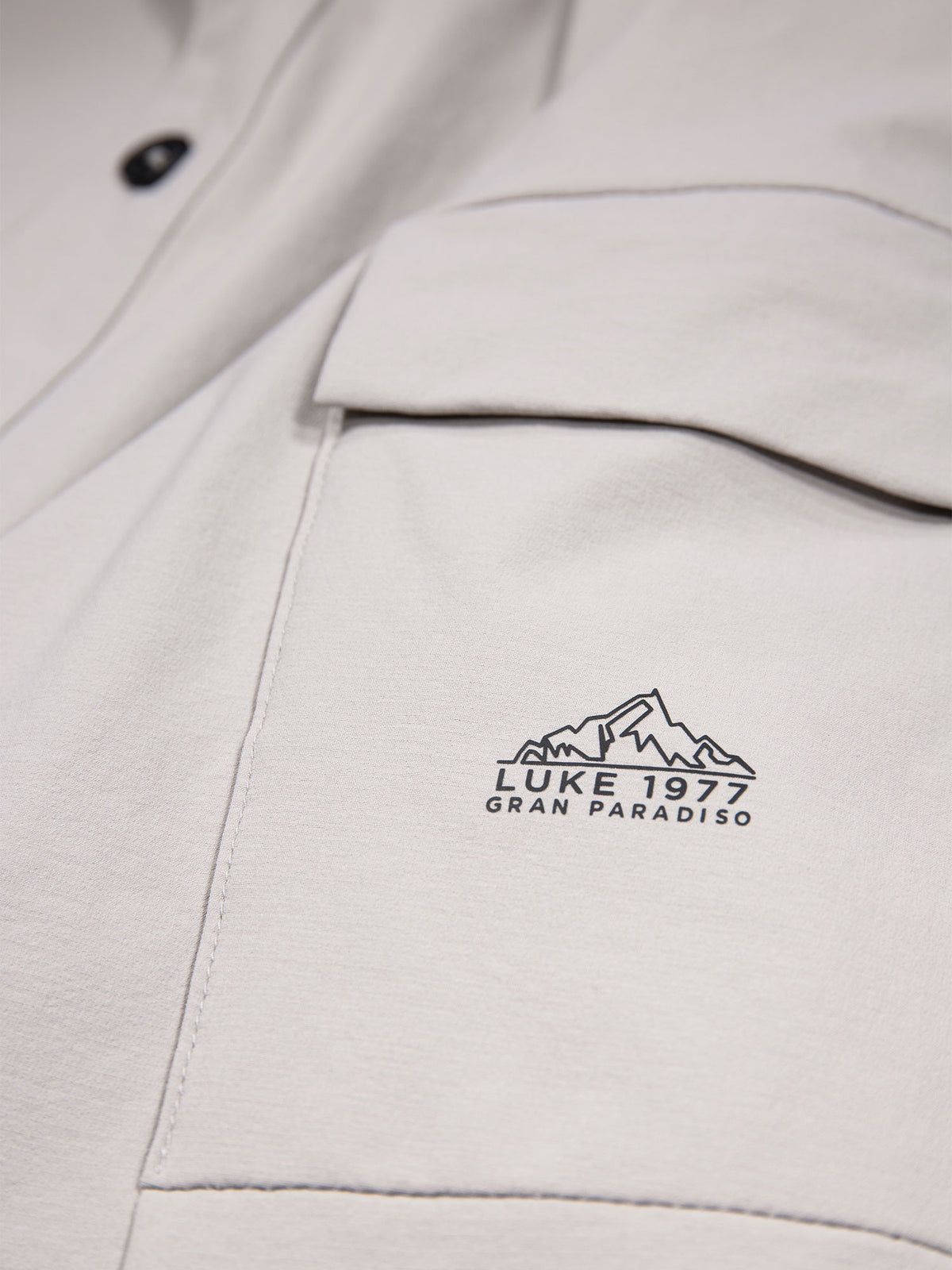 Close-up of LUKE 1977 Gran Paradiso reflective print on cement grey Canavese shirt