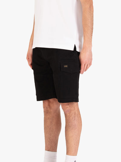 Men's black shorts with drawstring waistband and cargo pockets, worn by a model, side view