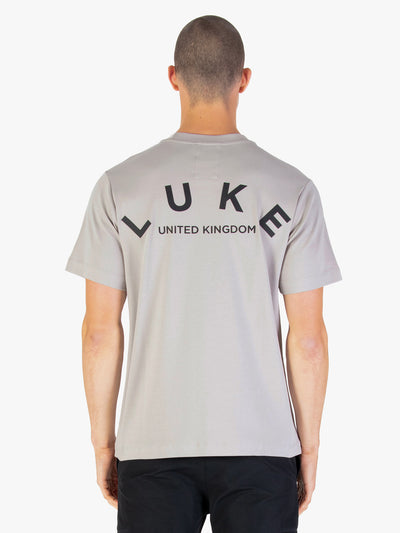 Men's relaxed-fit grey t-shirt with crew neck and short sleeves worn by a model - front view.