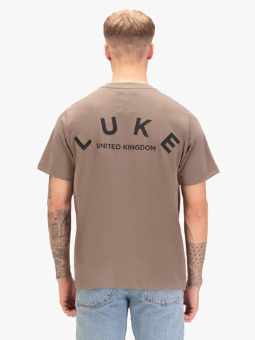 Men's relaxed-fit brown t-shirt with crew neck and short sleeves, worn by a model, back view