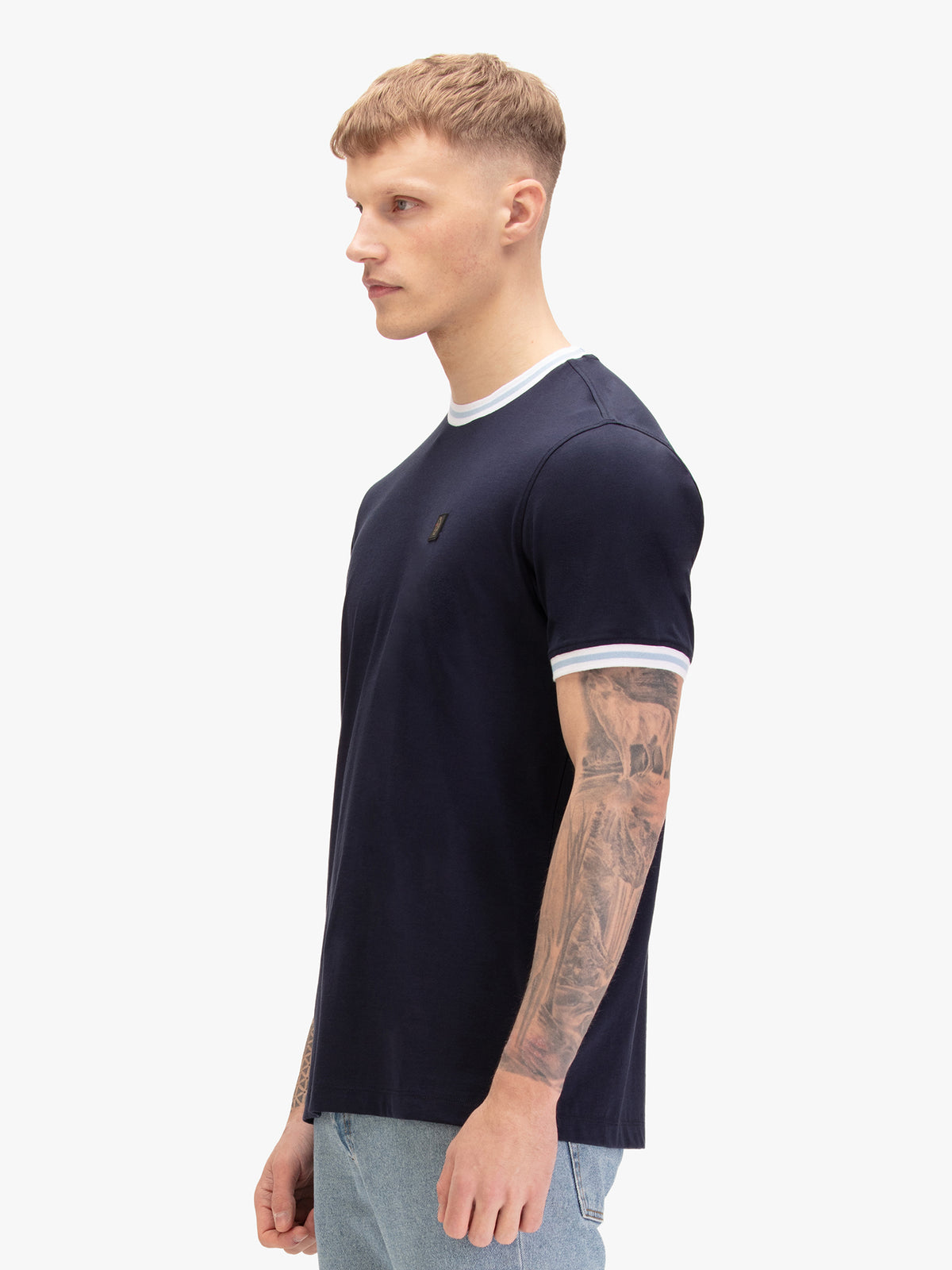 Men's navy t-shirt with crew neck and short sleeves, worn by a model, side view