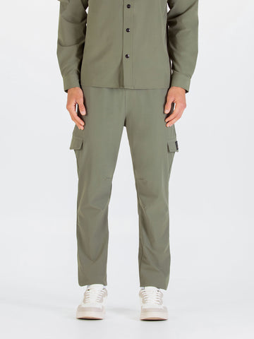 Men's green cargo trousers with cargo pockets.