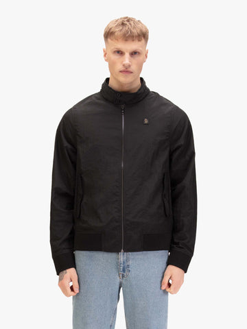 Men's black jacket with zip-up front and front pocket, worn by a model, front view