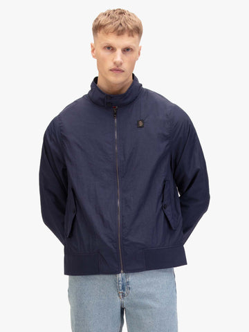 Men's navy jacket with zip-up front and front pocket, worn by a model, front view