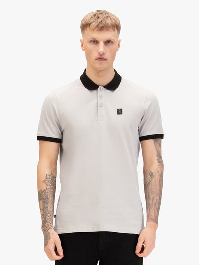Men's grey polo shirt with polo collar, worn by a model, front view