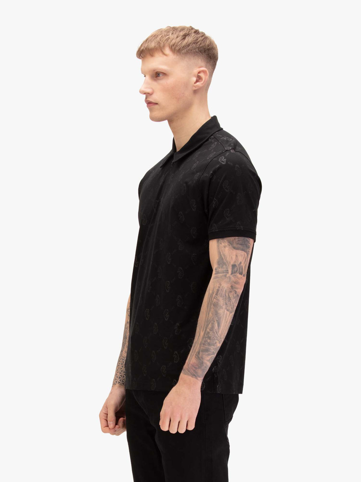 Men's black polo shirt with polo collar, worn by a model, side view