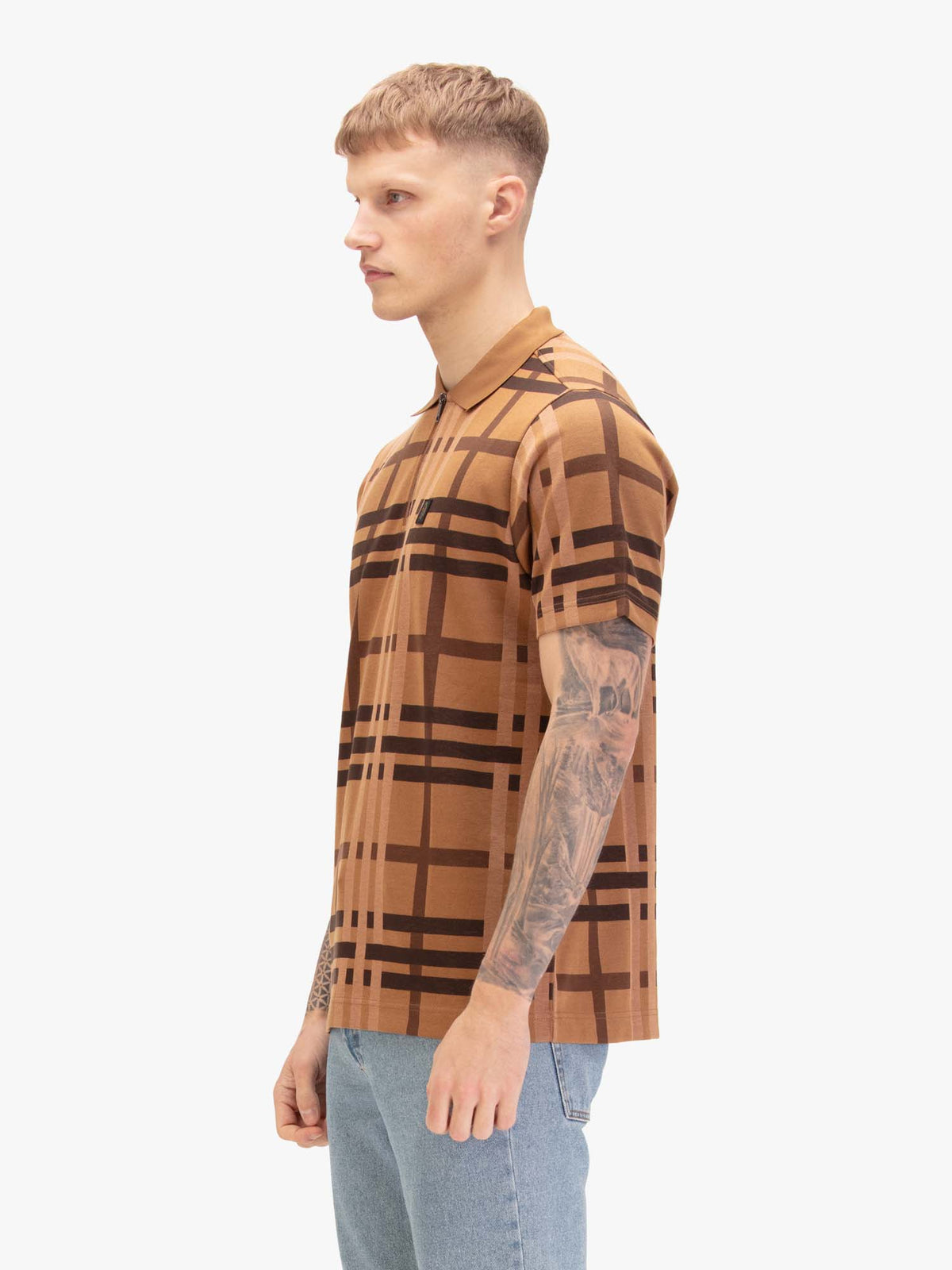Men's orange polo shirt with polo collar, worn by a model, front view