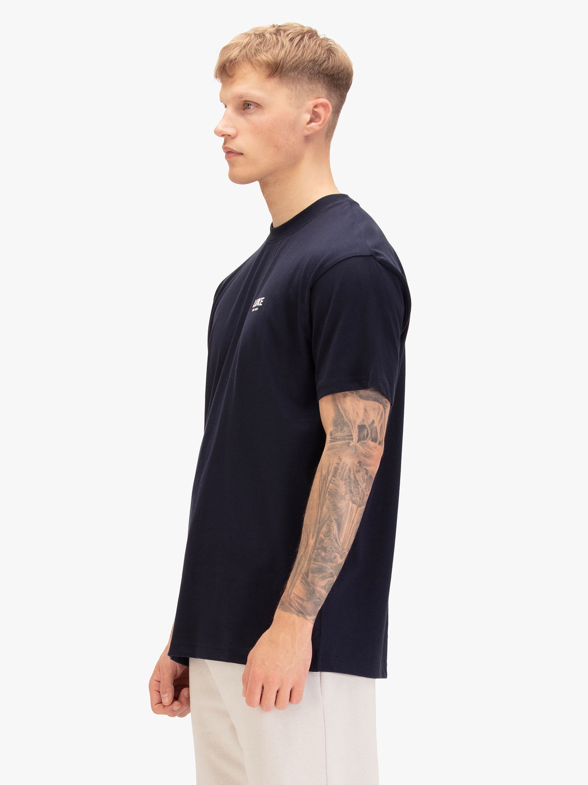Men's relaxed-fit navy t-shirt with crew neck and short sleeves, back view