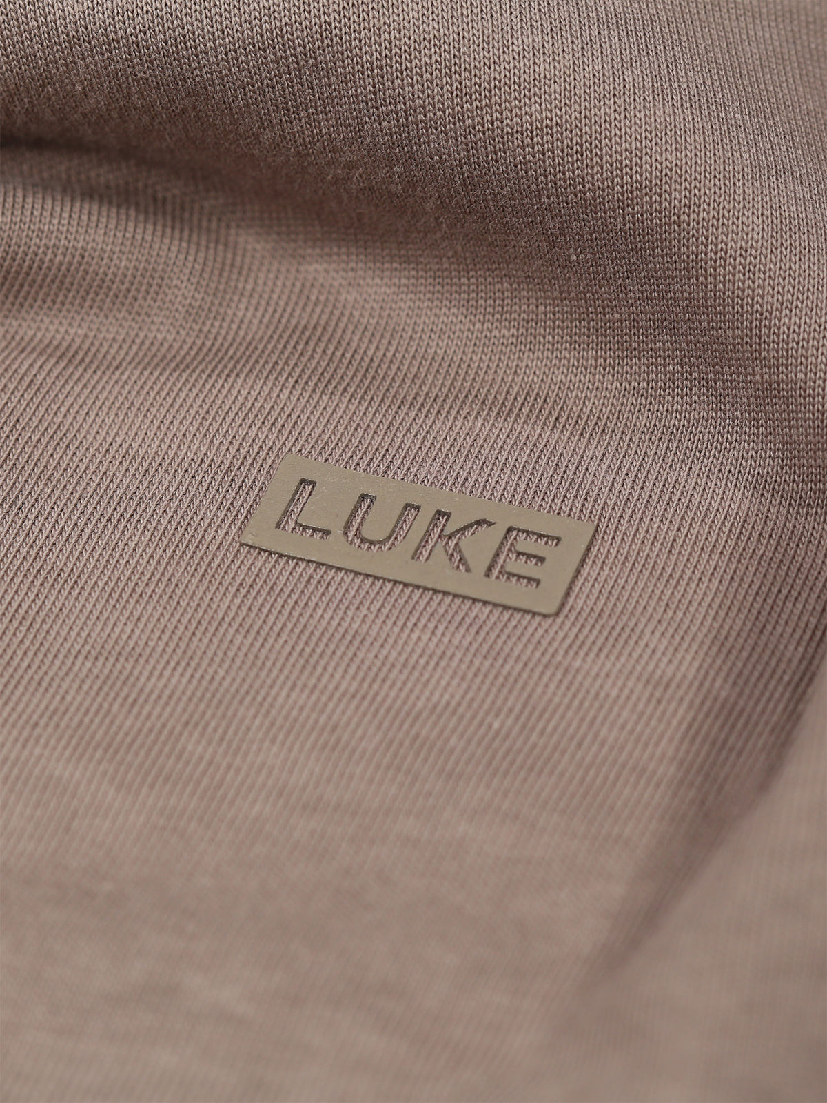 Men's brown t-shirt with crew neck and short sleeves worn by a model - side view.
