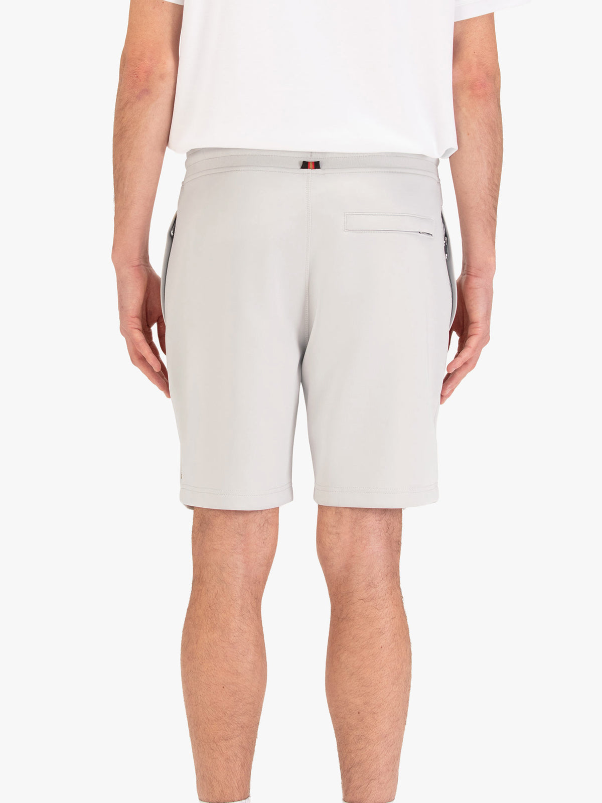 Men's grey shorts with drawstring waistband, worn by a model, back view