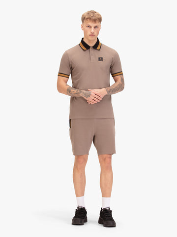 Men's brown short set with short-sleeve shirt and drawstring shorts, worn by model.
