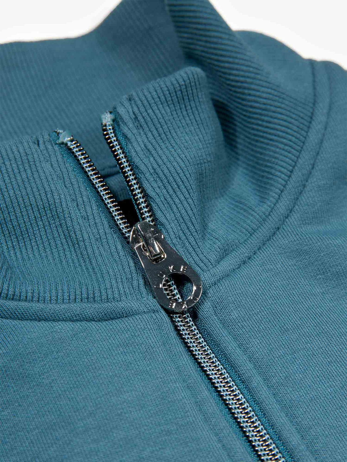Men's blue sweatshirt with quarter-zip neck, detail view