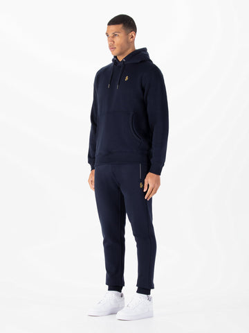 Men's navy tracksuit with pullover hoodie and matching joggers.
