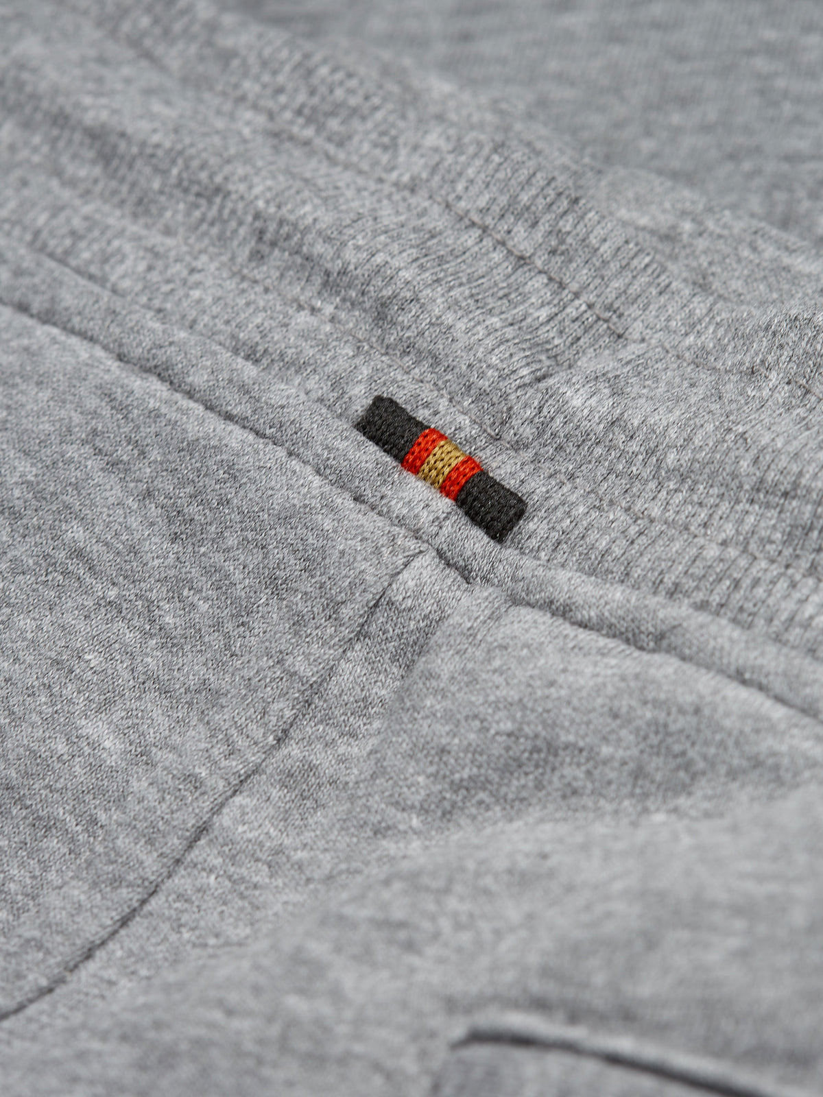 Men's grey tracksuit with crew neck sweatshirt and matching joggers.