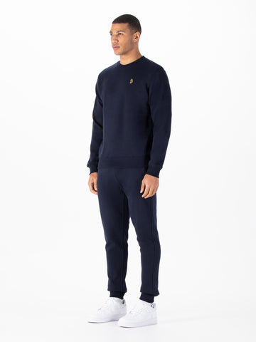 Men's navy tracksuit with crew neck sweatshirt and matching joggers.