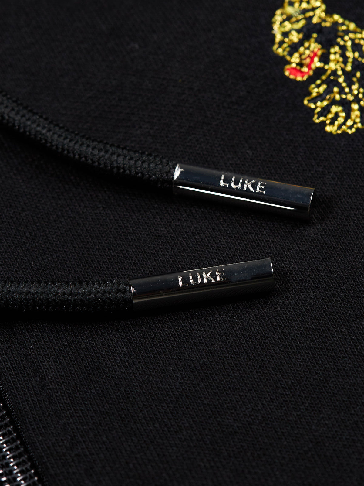 Men's black tracksuit with zip-up hoodie and matching joggers.