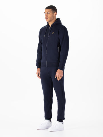 Men's navy tracksuit with zip-up hoodie and matching joggers.