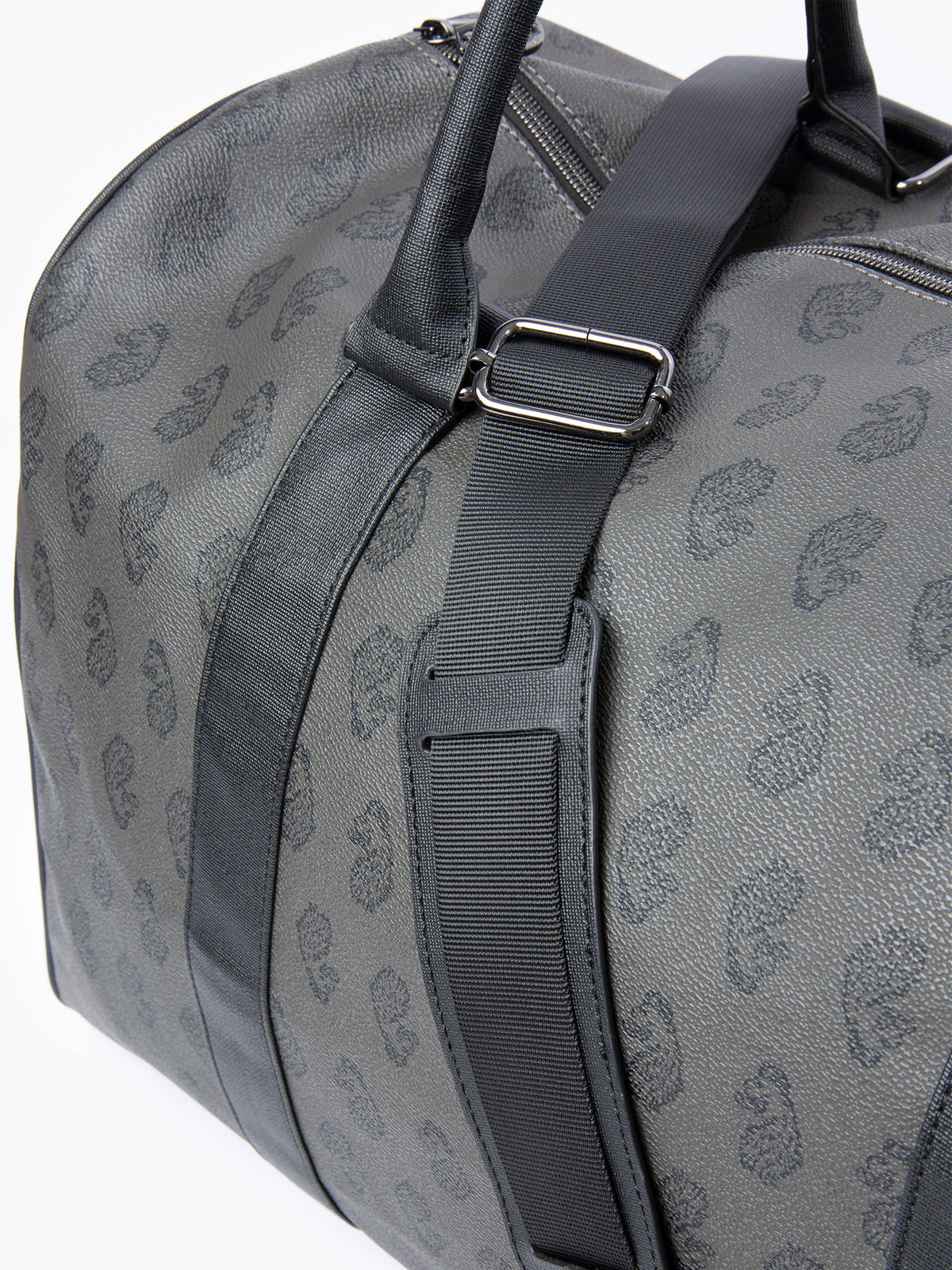 Close-up of carry handles and lion head all over print on Walsh holdall bag