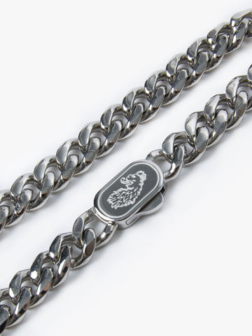 Close-up of engraved LUKE clasp on stainless steel Cuban link bracelet