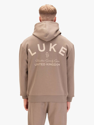 Men's relaxed-fit brown hoodie with front pocket and drawstring hood, worn by a model, back view