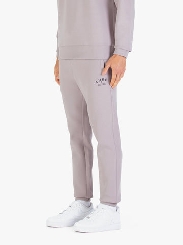 Men's grey joggers with drawstring waistband.