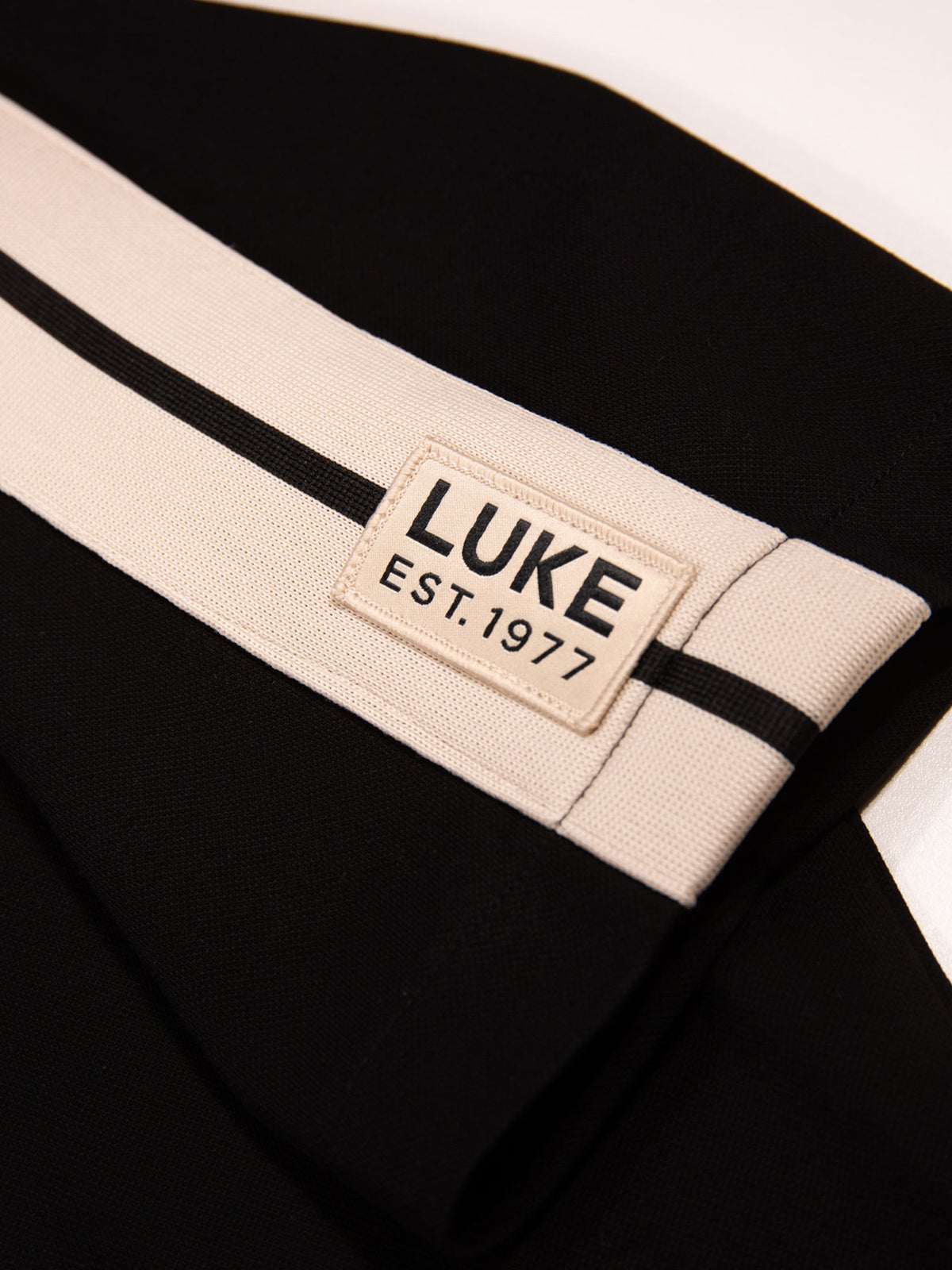 Men's black shirt with button-up front.