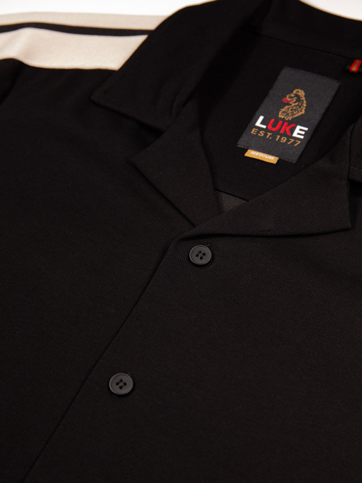 Men's black shirt with button-up front.