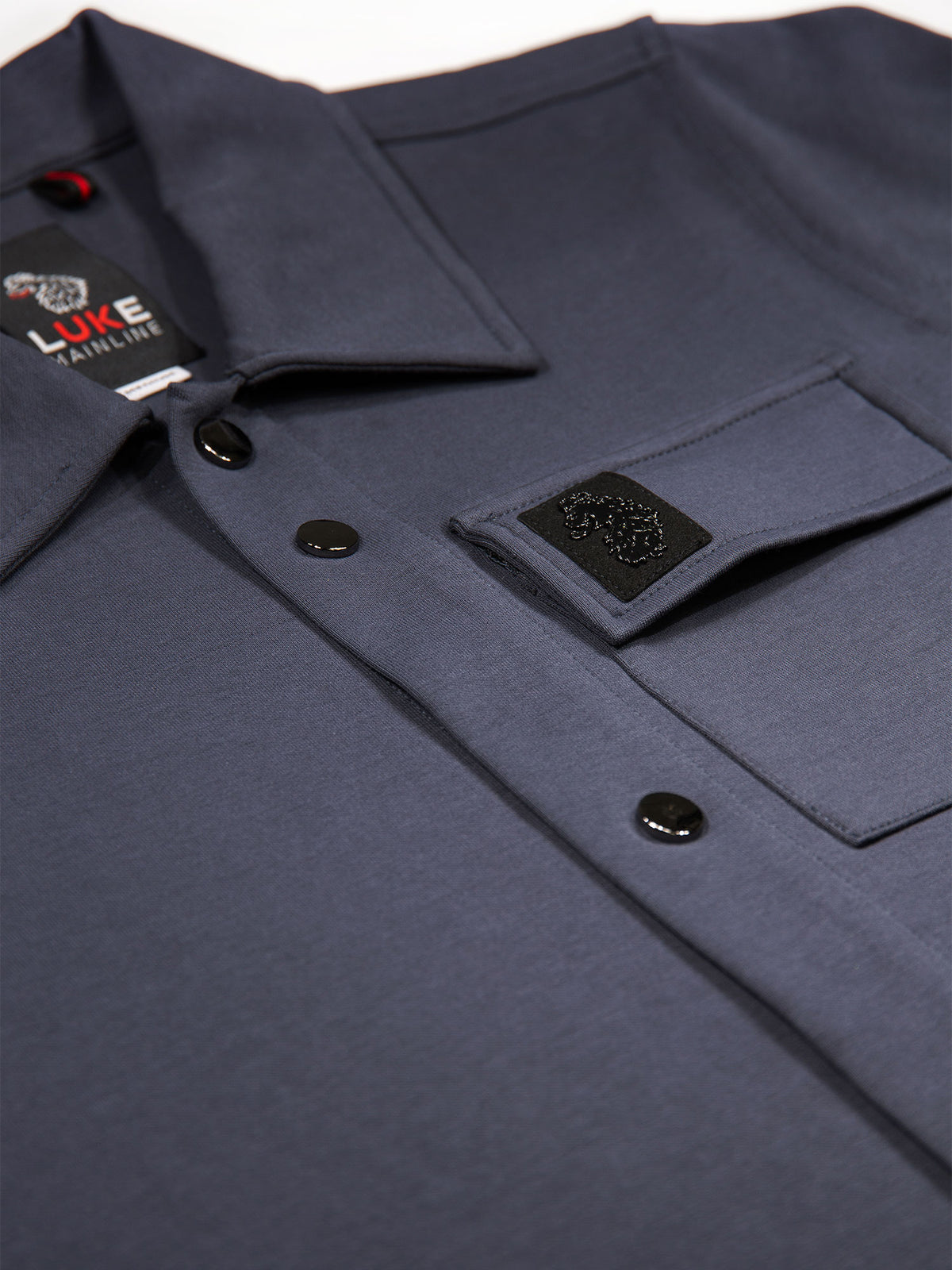 Men's grey shirt with button-up front.
