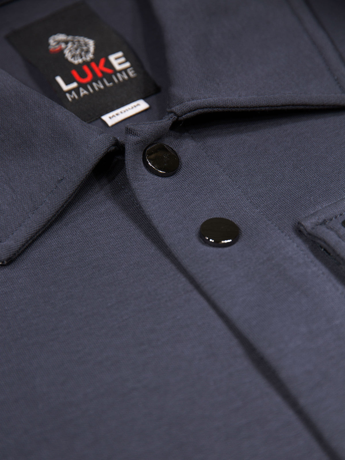Men's grey shirt with button-up front.