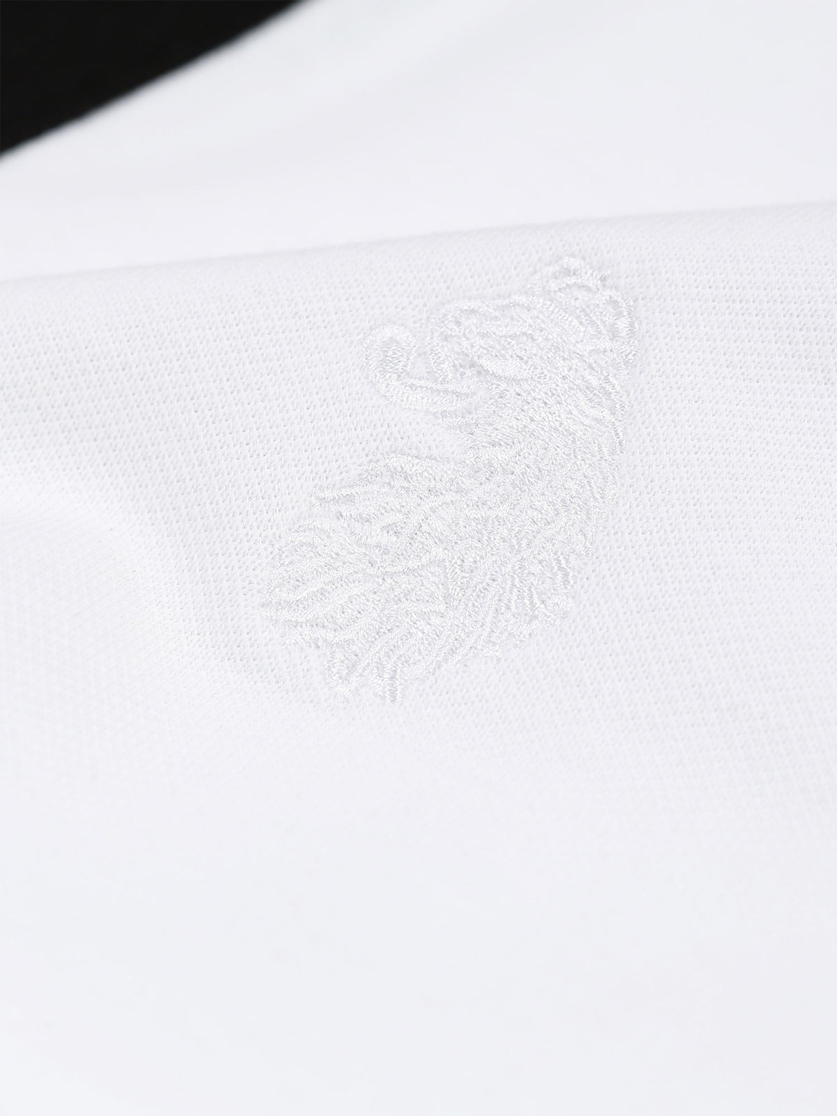 Men's white polo shirt with polo collar.