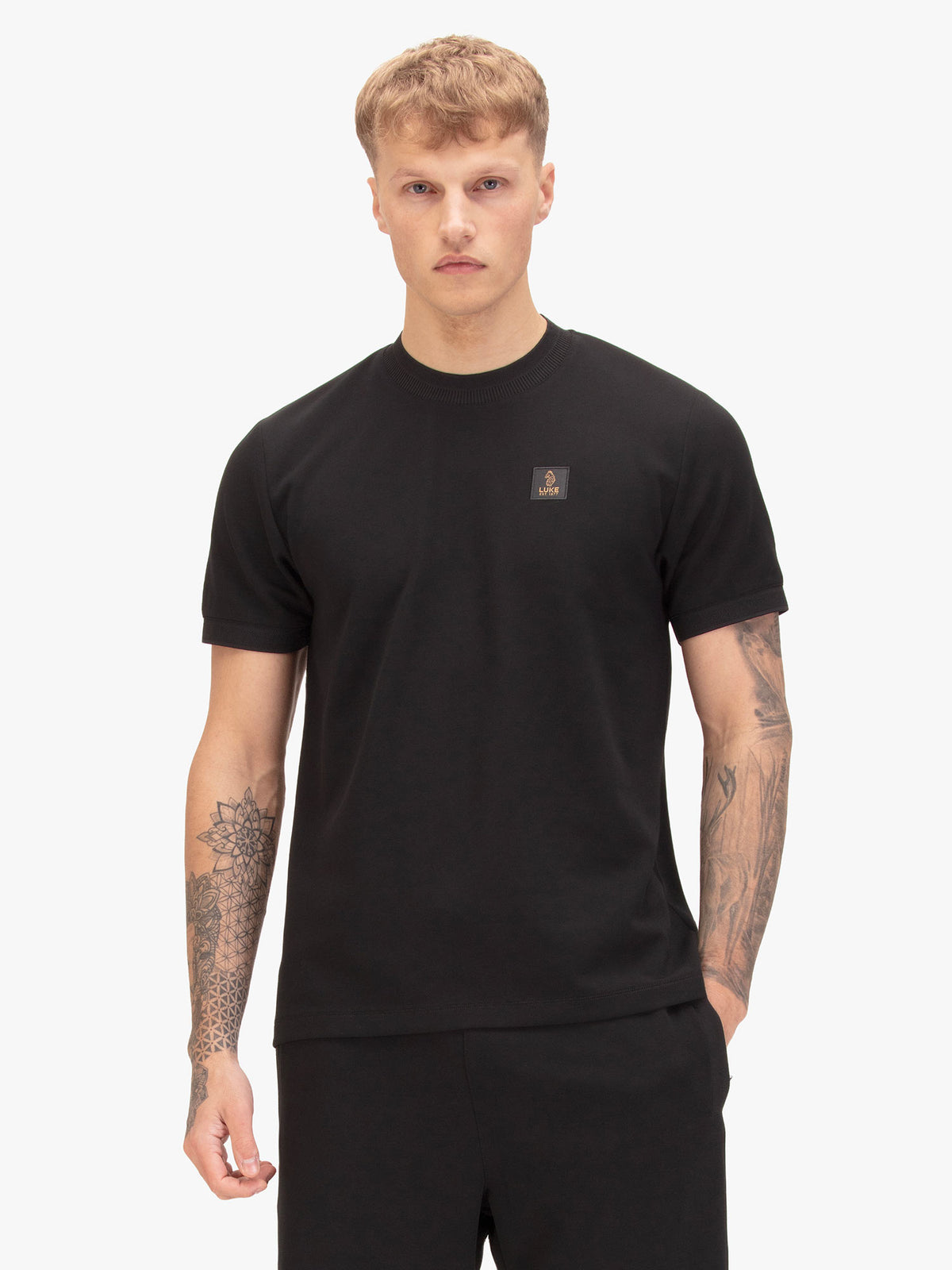 Men's black t-shirt with crew neck and short sleeves, front view