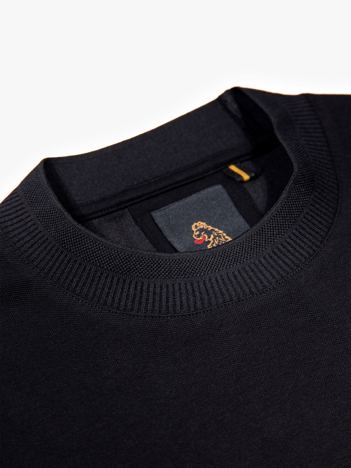 Men's black t-shirt with crew neck and short sleeves, detail view